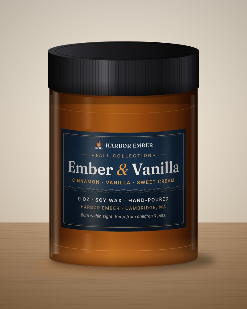 Harbor Ember Ember & Vanilla 9 oz soy candle in an amber jar with a black lid